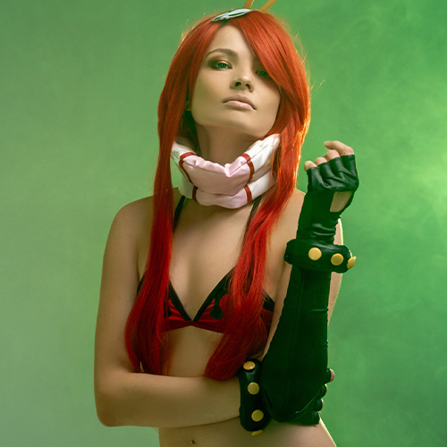 Stunning Yoko Littner cosplay from Tengen Toppa Gurren Lagann, featuring a lifelike portrayal of the character with her signature red hair, bold black and red bikini outfit, and green mist background. Perfect for fans searching for Yoko Littner cosplay inspiration or Gurren Lagann cosplay ideas.