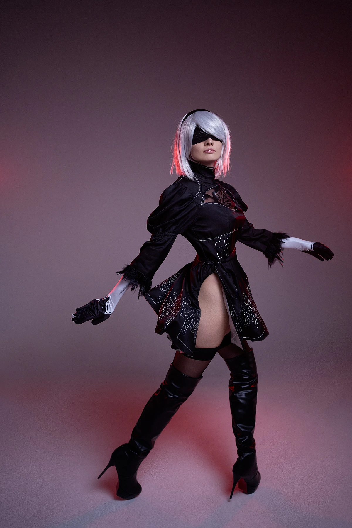 2B cosplay dramatic portrait with red rim light, silver bob, black blindfold, slit YoRHa dress, NieR Automata studio photography