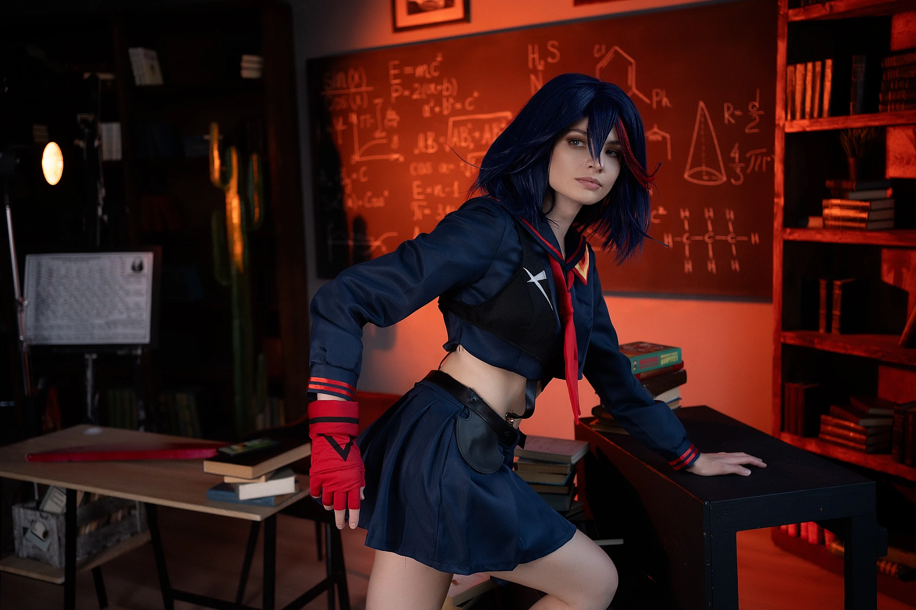 Ryuko Matoi cosplay in wide combat stance lifting scissor blade in magenta-violet light