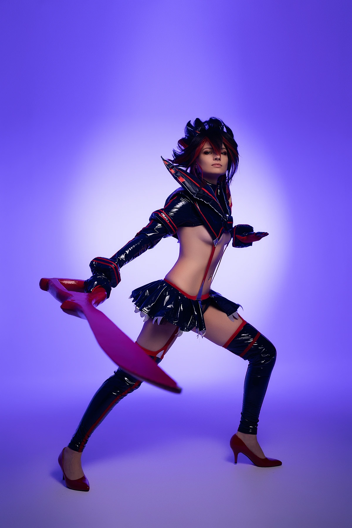 Ryuko Matoi cosplay wide action stance sweeping scissor blade motion violet studio background glossy outfit Kill la Kill combat