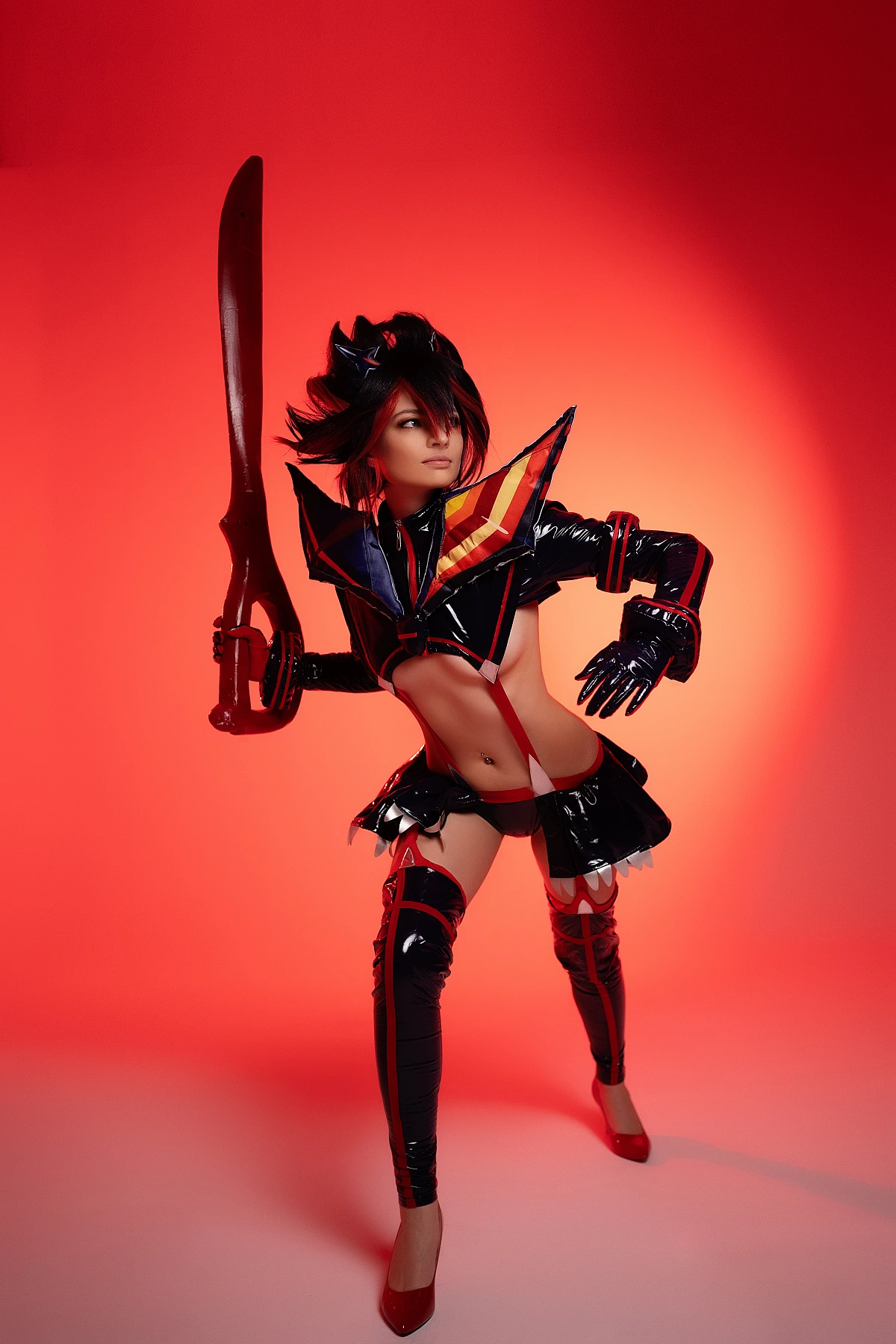 Ryuko Matoi cosplay combat ready pose raised scissor blade deep red studio lighting high contrast silhouette Kill la Kill battle