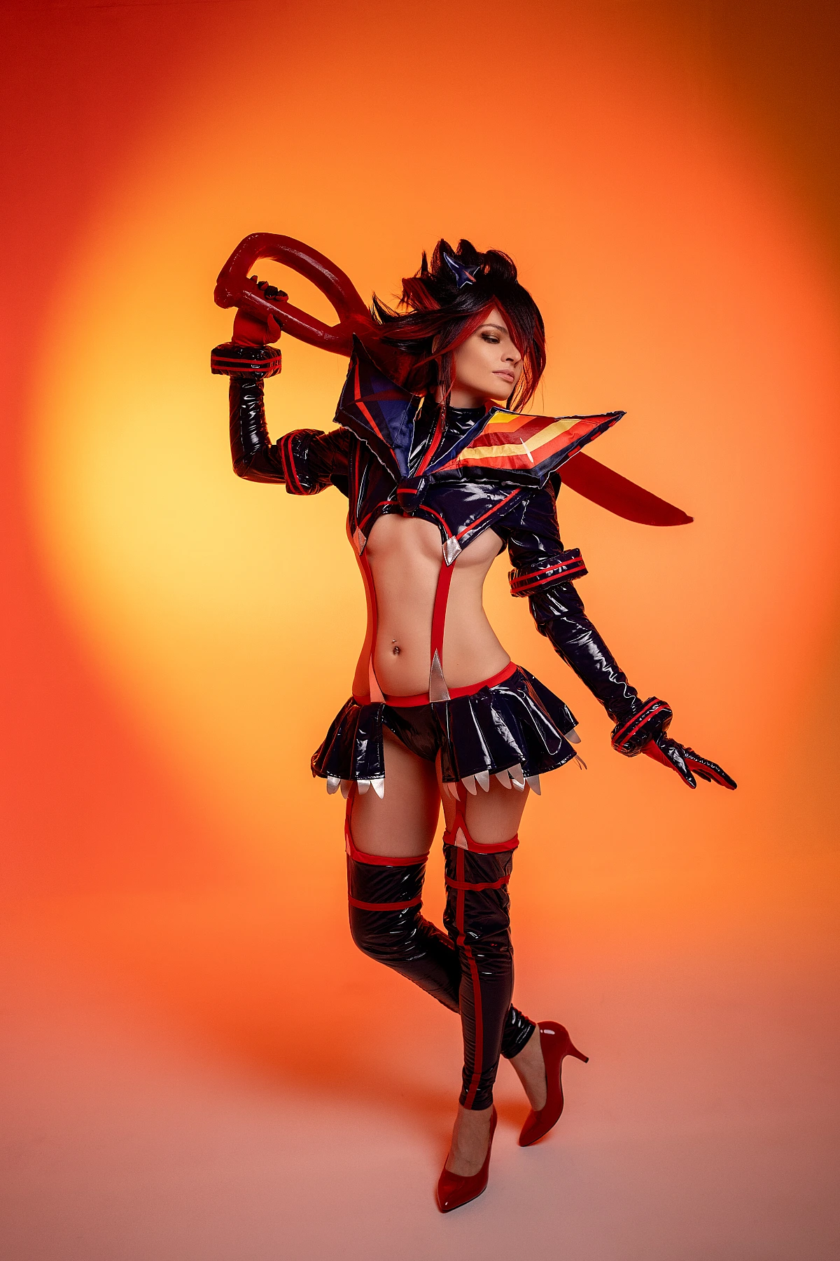Ryuko Matoi cosplay side profile view scissor blade over shoulder orange neon studio background wetlook glossy outfit Kill la Kill