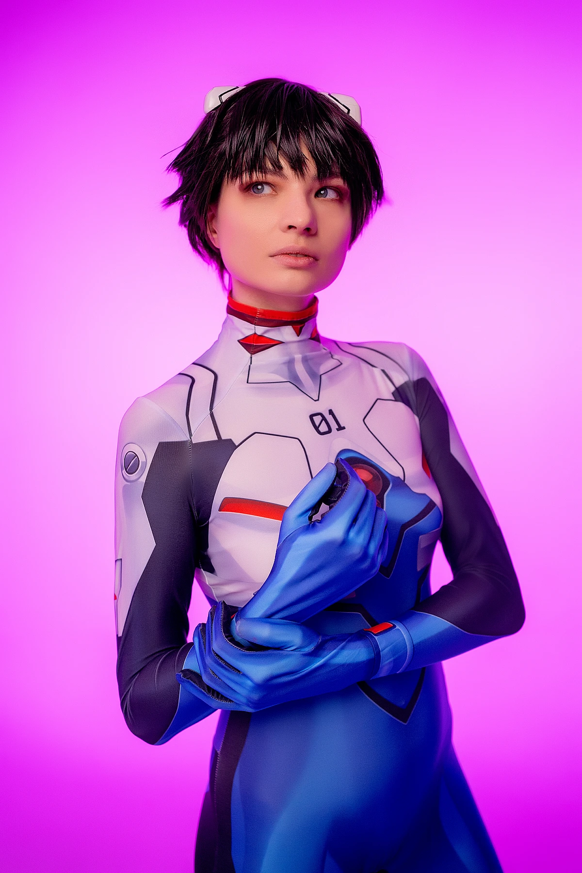 androgynous trap Shinji Ikari cosplay, blue-white bodysuit, hands clasped, purple studio background, anime crossplay photography