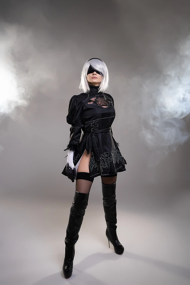 Full body 2B YoRHa cosplay in smoke, silver hair, black blindfold, slit dress and thigh-high boots, NieR Automata
