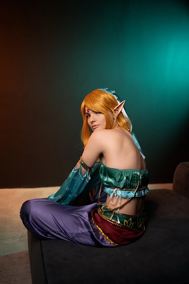 Gerudo Link cosplay back view showing open-back top and ornate belt
