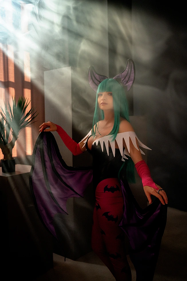 Cinematic Morrigan Aensland cosplay with window light beams, soft shadows, opened succubus wings, green hair