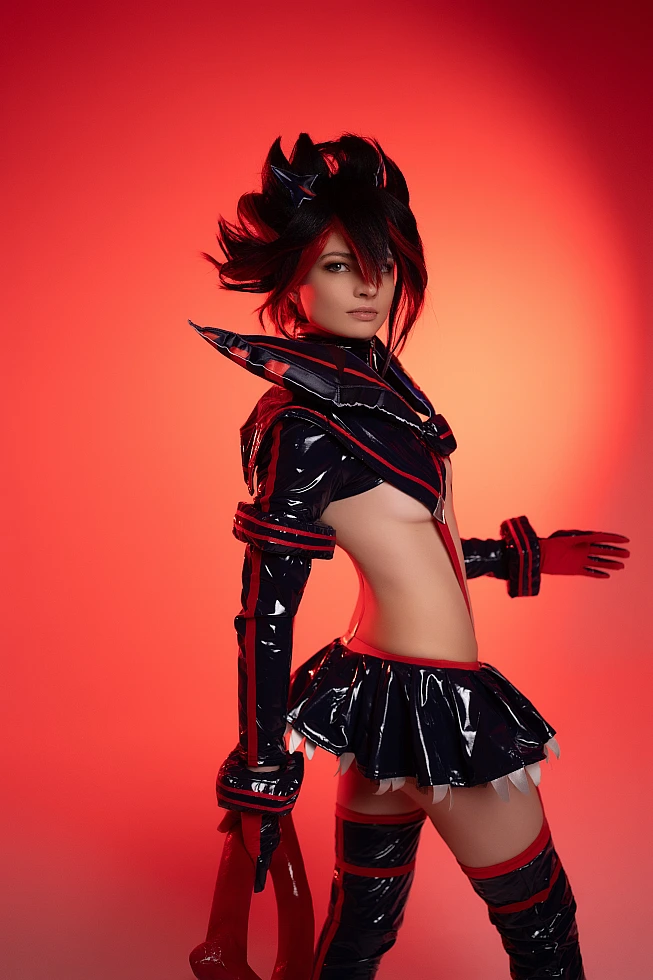 Ryuko Matoi cosplay side profile silhouette crimson red studio lighting glossy Senketsu outfit contour highlights Kill la Kill elegant