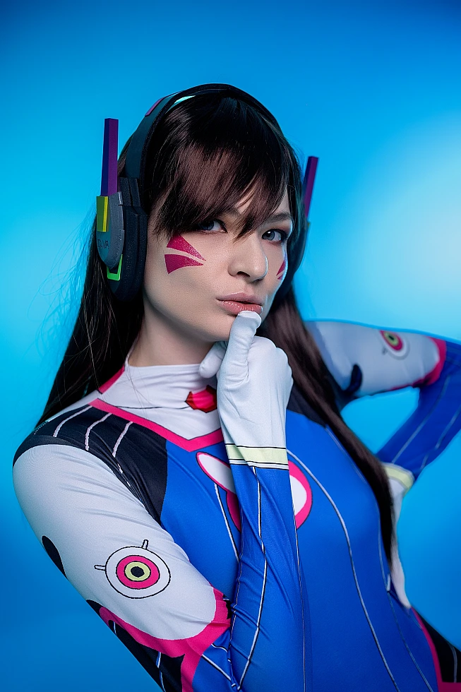 D.Va Overwatch cosplay close-up portrait face markings headset detail cool blue lighting makeup reference