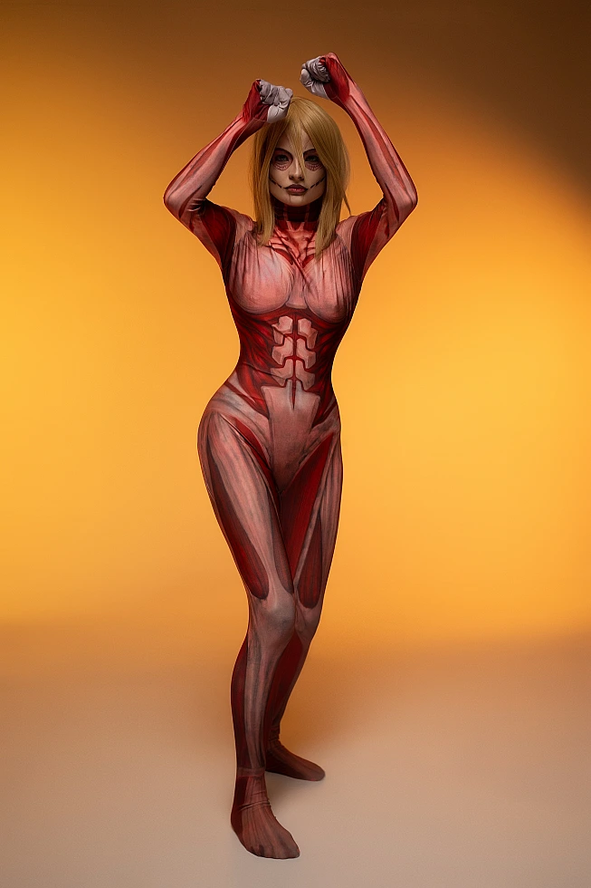 Female Titan cosplay full-body studio pose, raised arms, anatomical muscle bodysuit, Attack on Titan anime cosplay