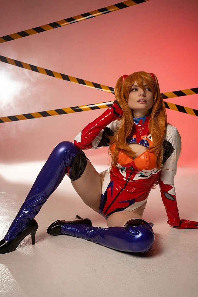 Asuka floor pose cosplay with sweat-gloss finish in latex plugsuit red cinematic lighting